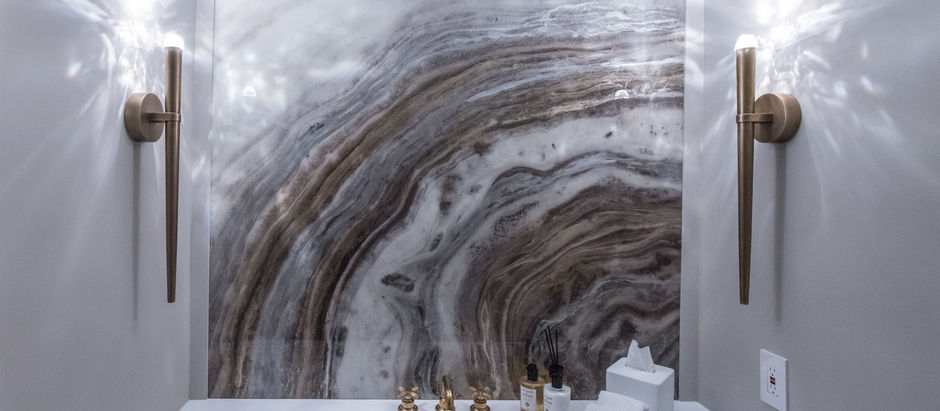 Stone slab accent wall in a powder room