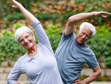 Seniors stretching outdoors