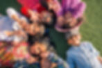 many happy children lying on the lawn of a park, concept of friendship.jpg