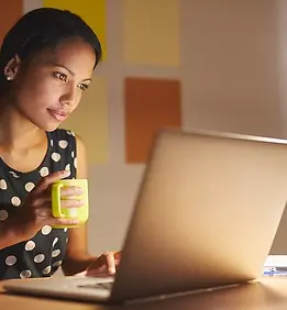 A young woman working on her laptop in h.jpg.webp