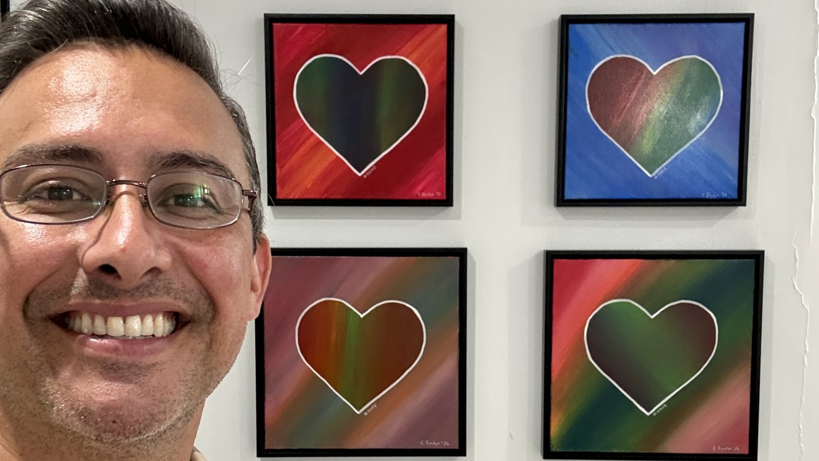Edward Rocha with four paintings from the Heart Series