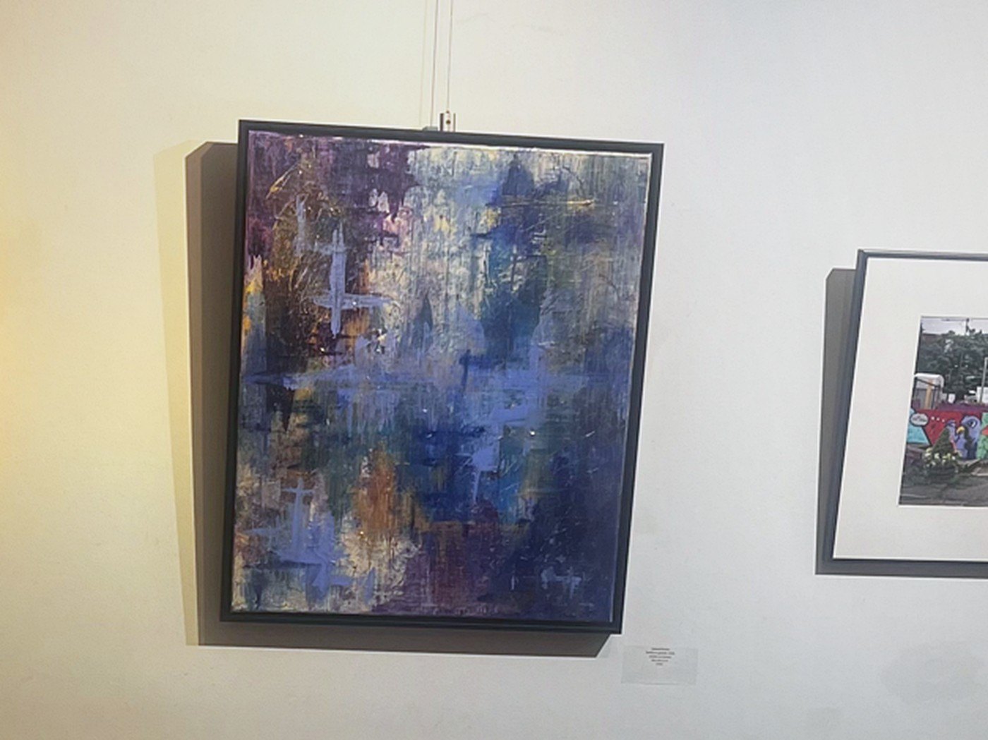 Edward's blue and violet painting hanging at The Betty Meyer Gallery