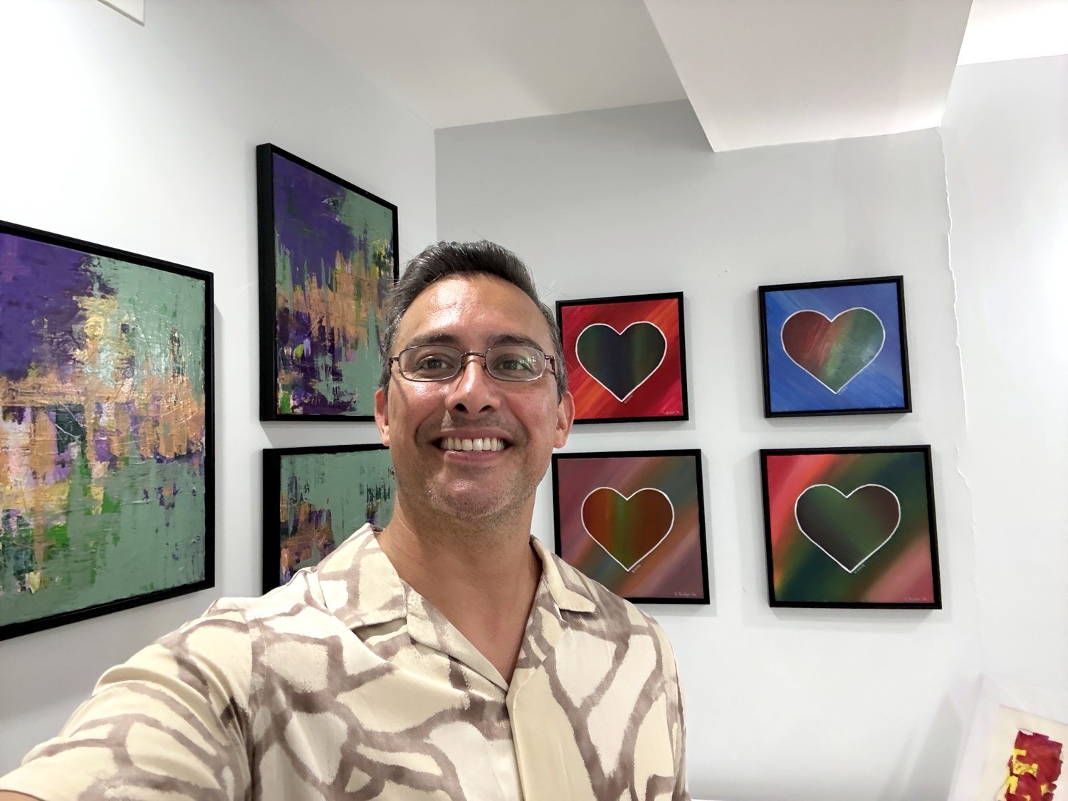 Edward in front of the Heart Series and Purple Clover paintings
