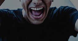man in black crew neck t-shirt smiling_e