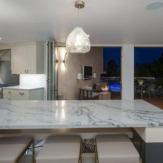 bespoke oversized natural inspirations nebula pendant drop above a kitchen island