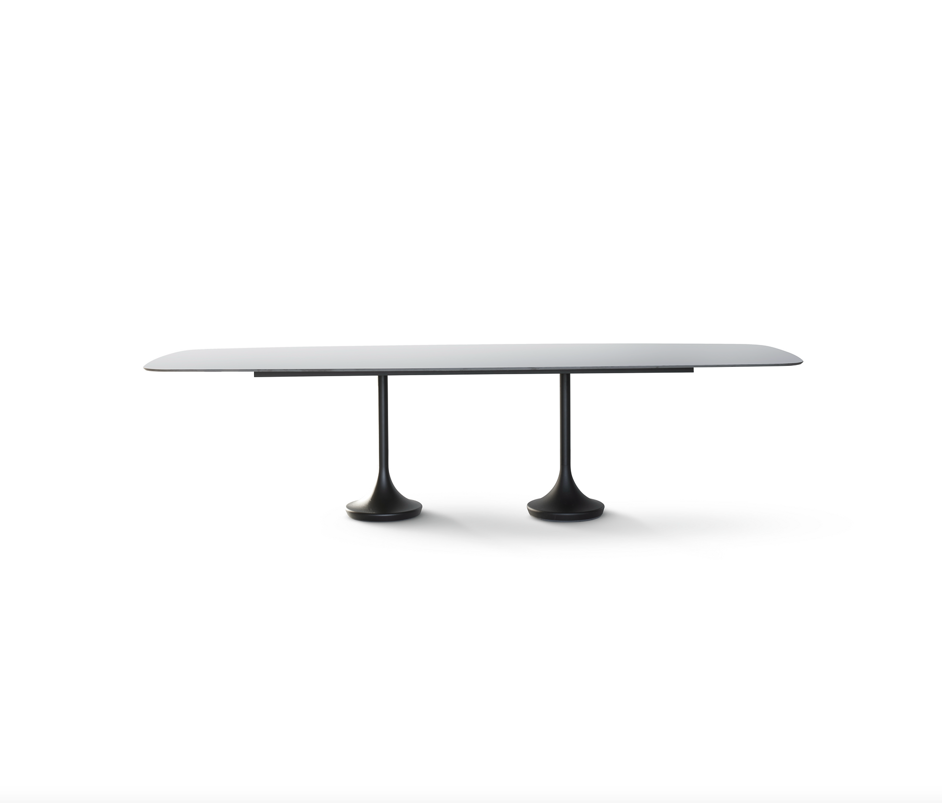 central oval dining table with metal base and ceramic top