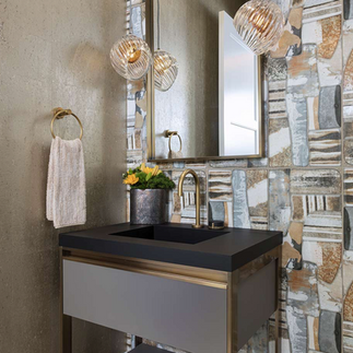 studio glass wall lights beside a mirror in a powder room setting