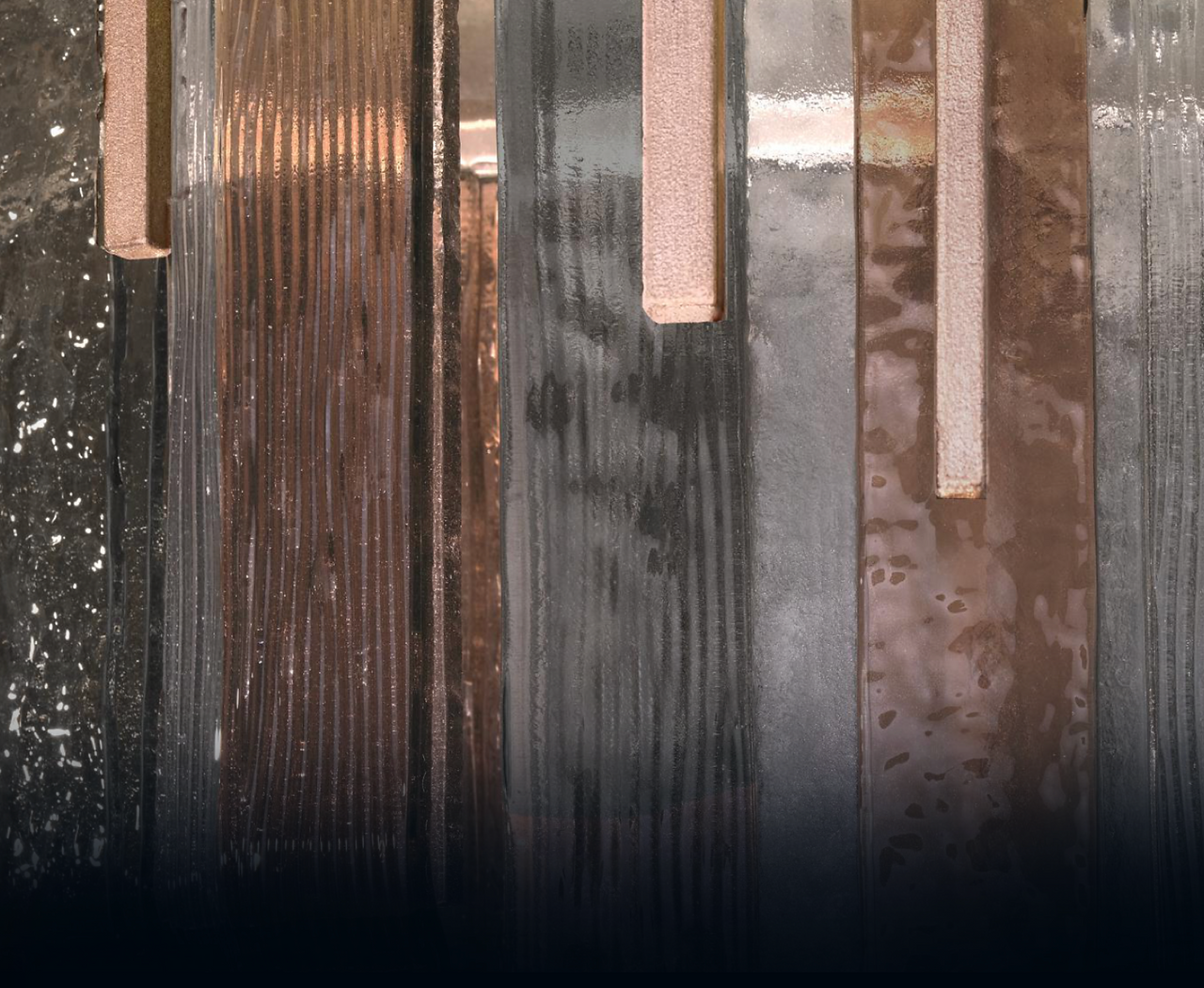 arpeggio layered studio glass in clear, smoke and bronze with hammered and linear glass effect