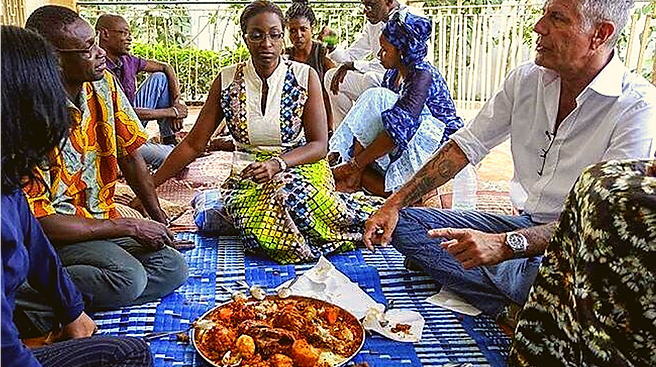 Pierre and Anthony Bourdain at family meal in Senegal