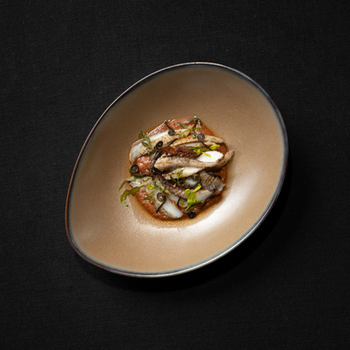 A Dish That Speaks of Land and Sea: Grilled Squid with Fermented Shrimp Sauce