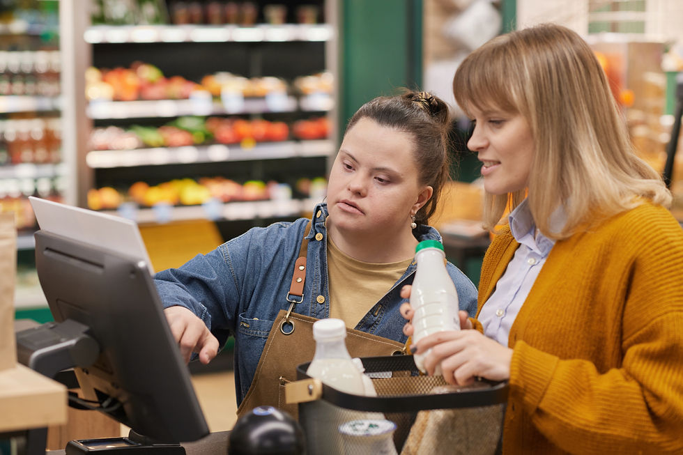 Waist up portrait of young woman with Down syndrome helping customer at self checkout whil