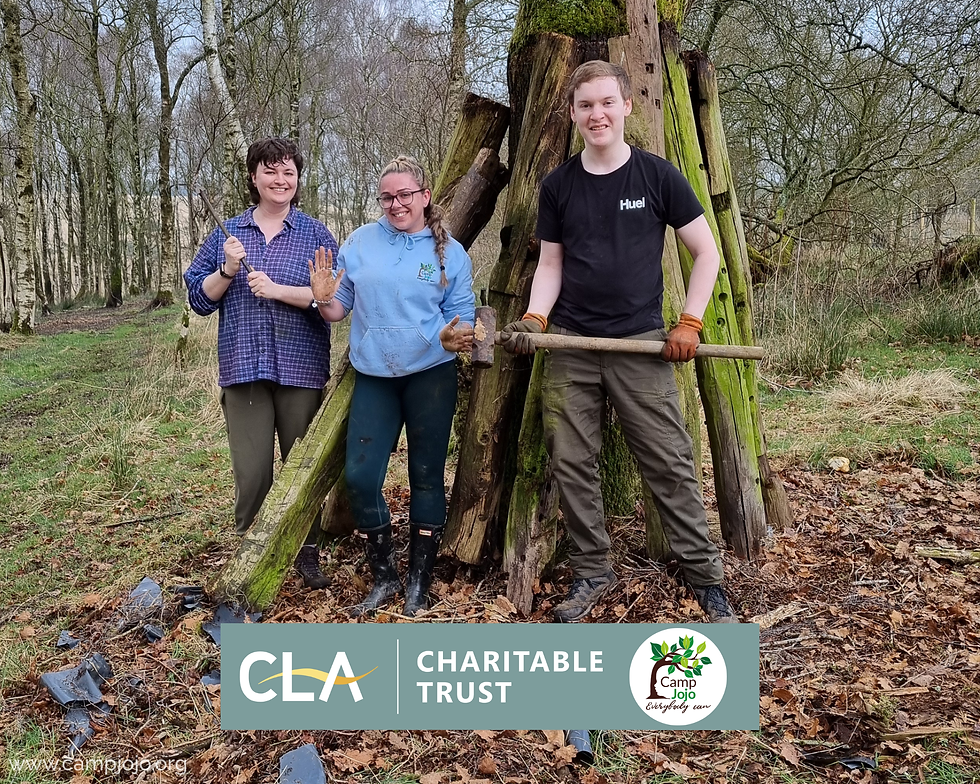 Volunteersstand next to a tree in woodland