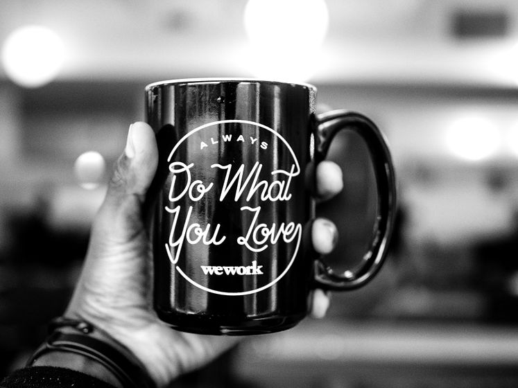 shallow focus photo person holding black ceramic mug_edited.jpg