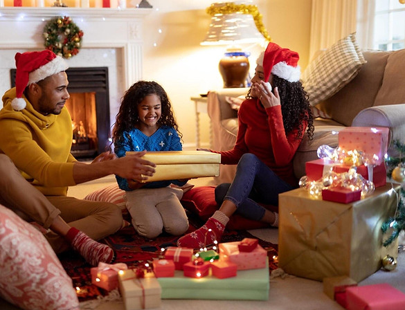 front-view-mixed-race-couple-with-their-young-daughter-their-sitting-room-christmas-wearin