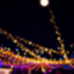 Blurred string lights at a night event