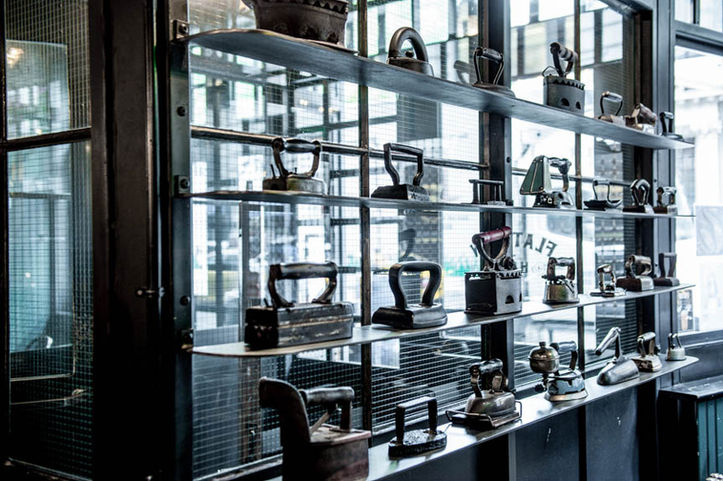 Custom metal entryway with metal shelving at Flat Iron Hall, New York by TMTHREE Partners