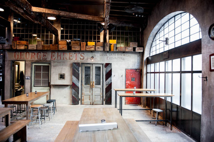 Interior view of hall with custom metal window design by TMTHREE Partners at Houston Hall, New York