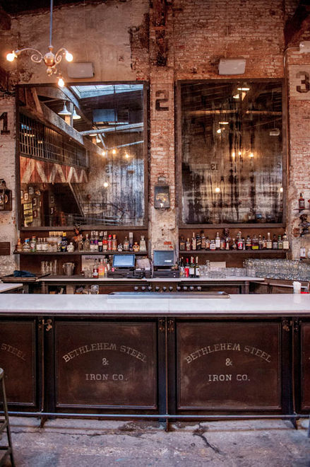 Interior scene featuring custom-designed metal bar at Houston Hall, New York