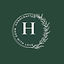 Handcrafted by Hayley logo- a white circular logo on a green background. It has the letter and in the middle of the circle and contains the words 'handcrafted' and 'made with love'
