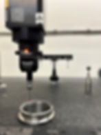 A v-band ring being inspected using a CMM machine