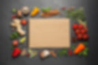 Open recipe book and different ingredients on black table, flat lay. Space for text.jpg