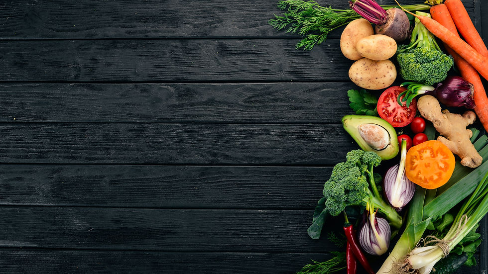 Healthy food. Vegetables and fruits. On a black wooden background. Top view. Copy space..j