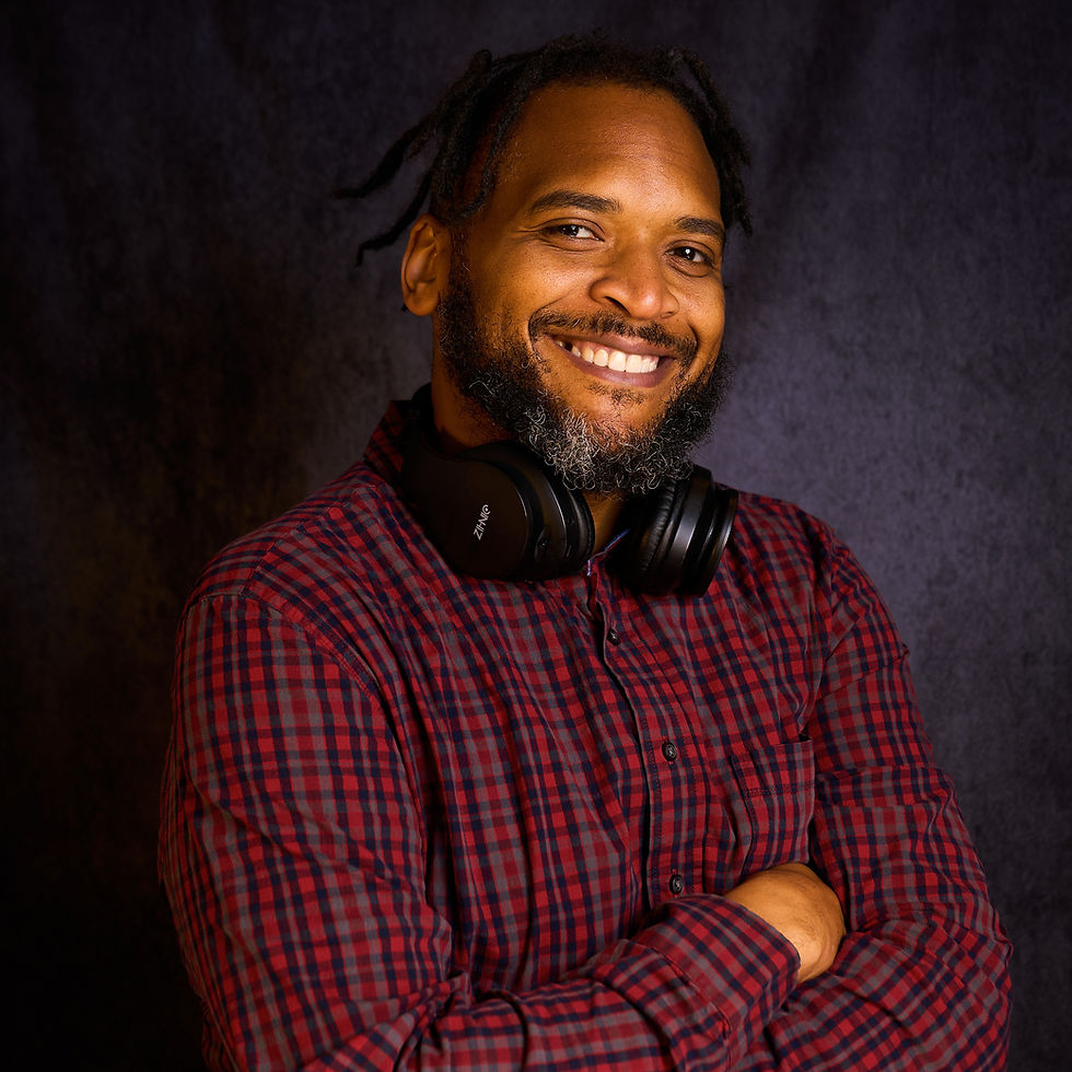 Minister Dizzle smiling with headphones in the Meet Minister Dizzle section