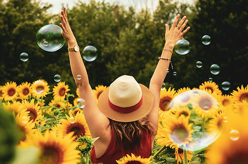 A woman in flowers feeling free from narcissistic abuse