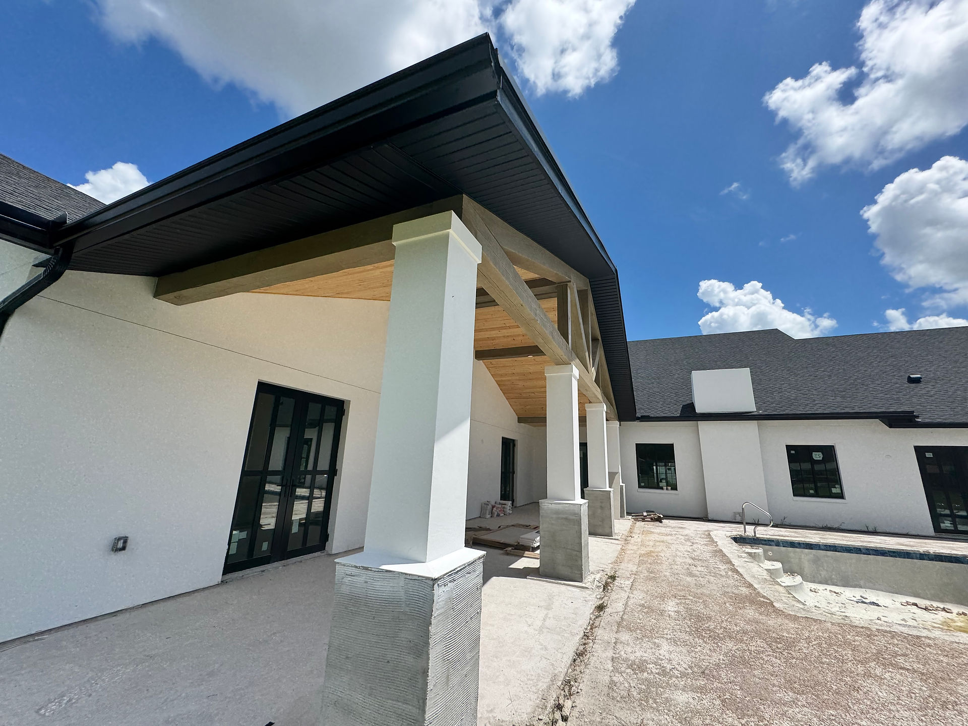 home with black soffit, fascia, and gutters by H2O Gutters