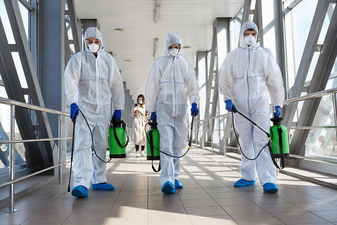 Specialist in hazmat suits cleaning disinfecting coronavirus cells epidemic, pandemic heal