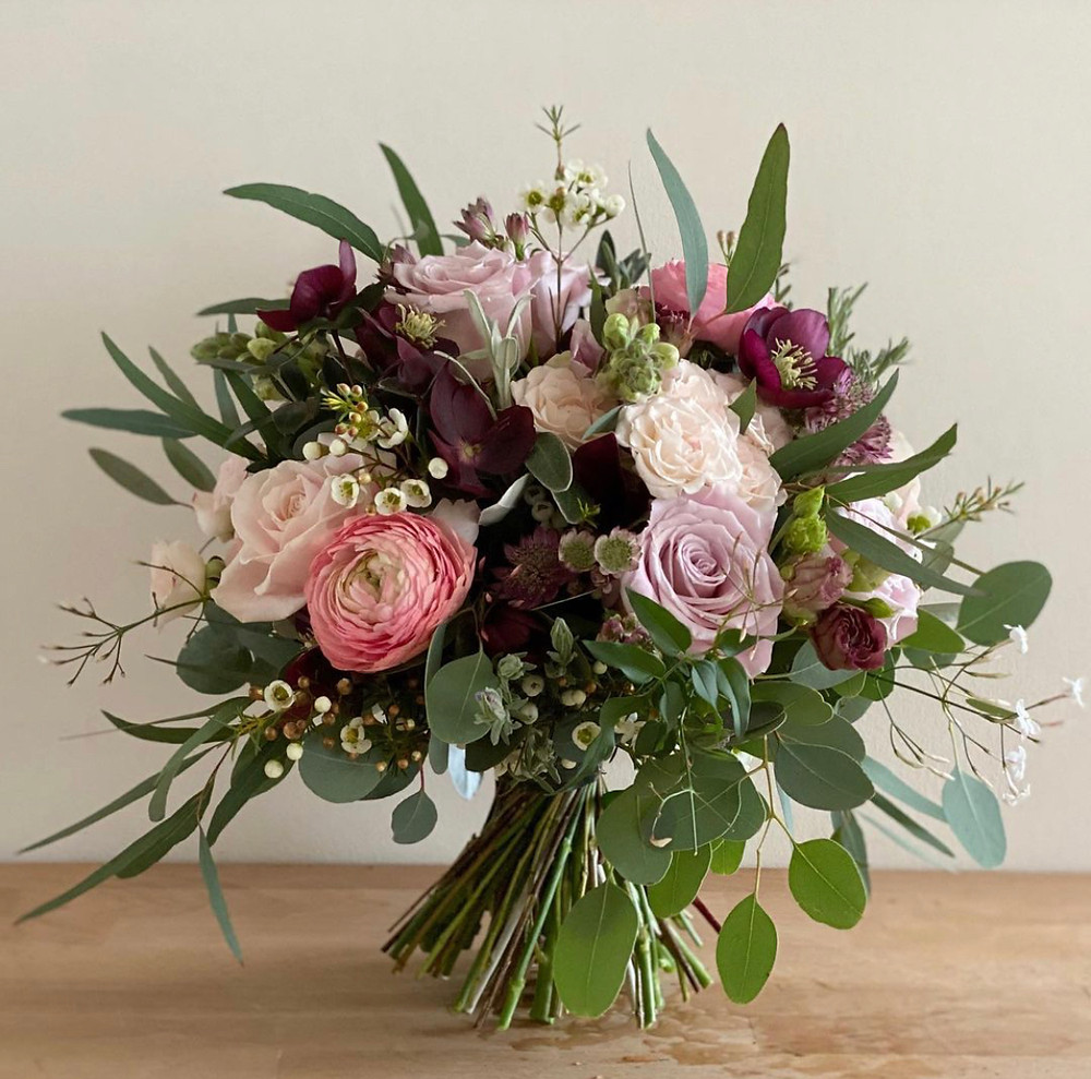 Ranunculus, Hellebores, Roses, Wax flower Bridal bouquet