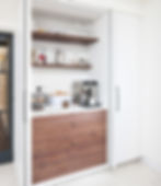 Poggenpohl pocket door unit to house additional kitchen storage and 'appliance garage'.