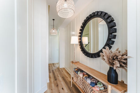 foyer, black round mirror, PB pendants, sand cloud towels, beach towels, beach decor, board and batton