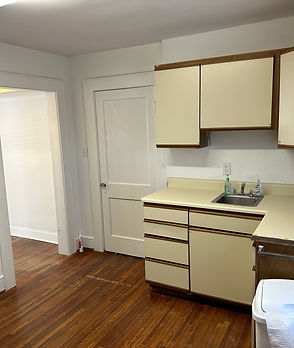 Fully-equipped kitchen in a rental property, featuring modern appliances and ample space for cooking and dining