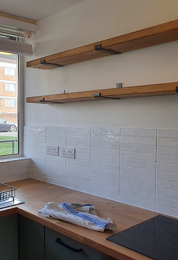 16:56Claude responded: Solid oak floating shelves with industrial brackets, white metro tiles and oak worktop by RedEgg Renovations BexleyheathSolid oak floating shelves with industrial brackets, white metro tiles and oak worktop by RedEgg Renovations Bexleyheath