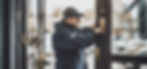 a professional locksmith technician unlocking a business storefront_edited.jpg