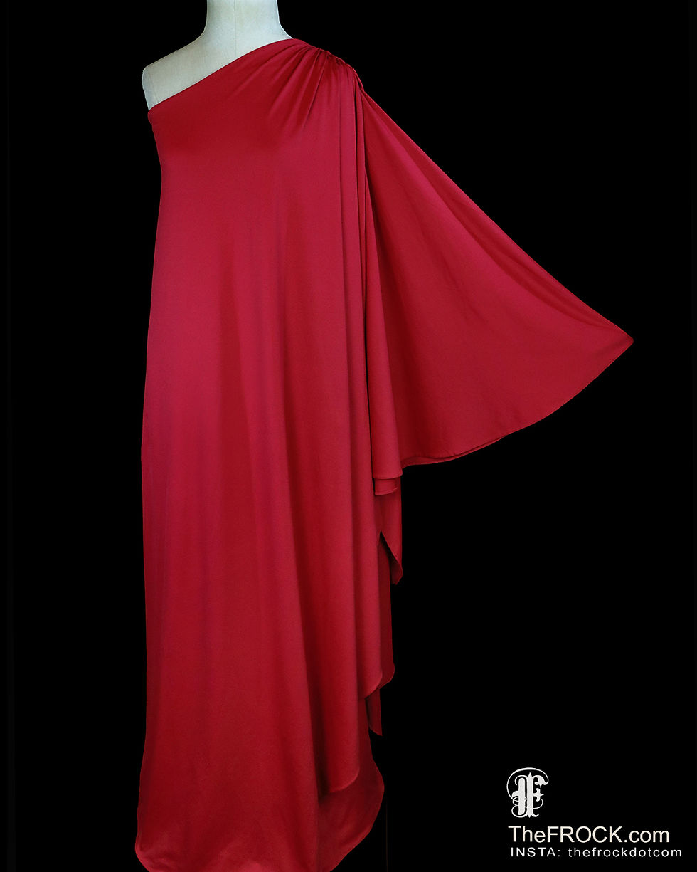 Vintage Halston red jersey toga dress or evening gown with a single outstretched sleeve.