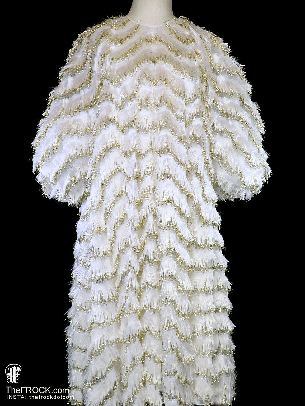 Dolce & Gabbana vintage-white and metallic gold eyelash fringe dress, documented archival runway couture with big balloon sleeves and an oversized trapeze silhouette.