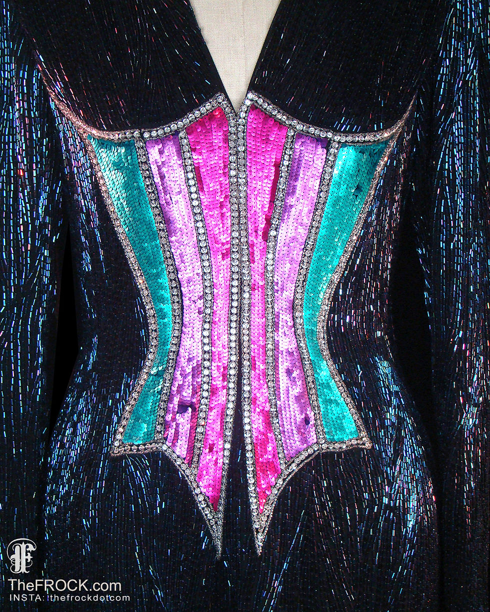 The illusion of a corset that's beaded onto the midsection of Bob Mackie gown