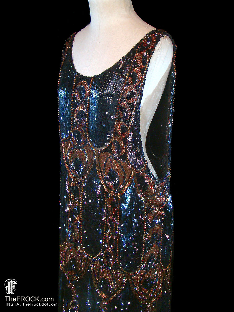 Vintage 1920s black sequin and Art Nouveau golden bronze beaded floor-length flapper dress with deep scoop neck and risqué open sides.