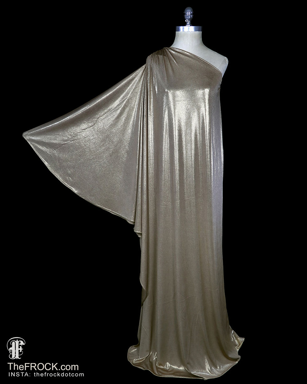Full length view of vintage HALSTON bronze metallic jersey toga dress with a single outstretched sleeve.