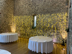Fairy light curtain with warm uplighting