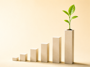 Ascending bar chart with a green sprout growing from the top bar representing small business financial growth through professional bookkeeping services in Erie County NY — Blooming Business