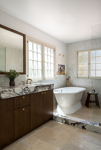 Spanish style primary bathroom with wet room