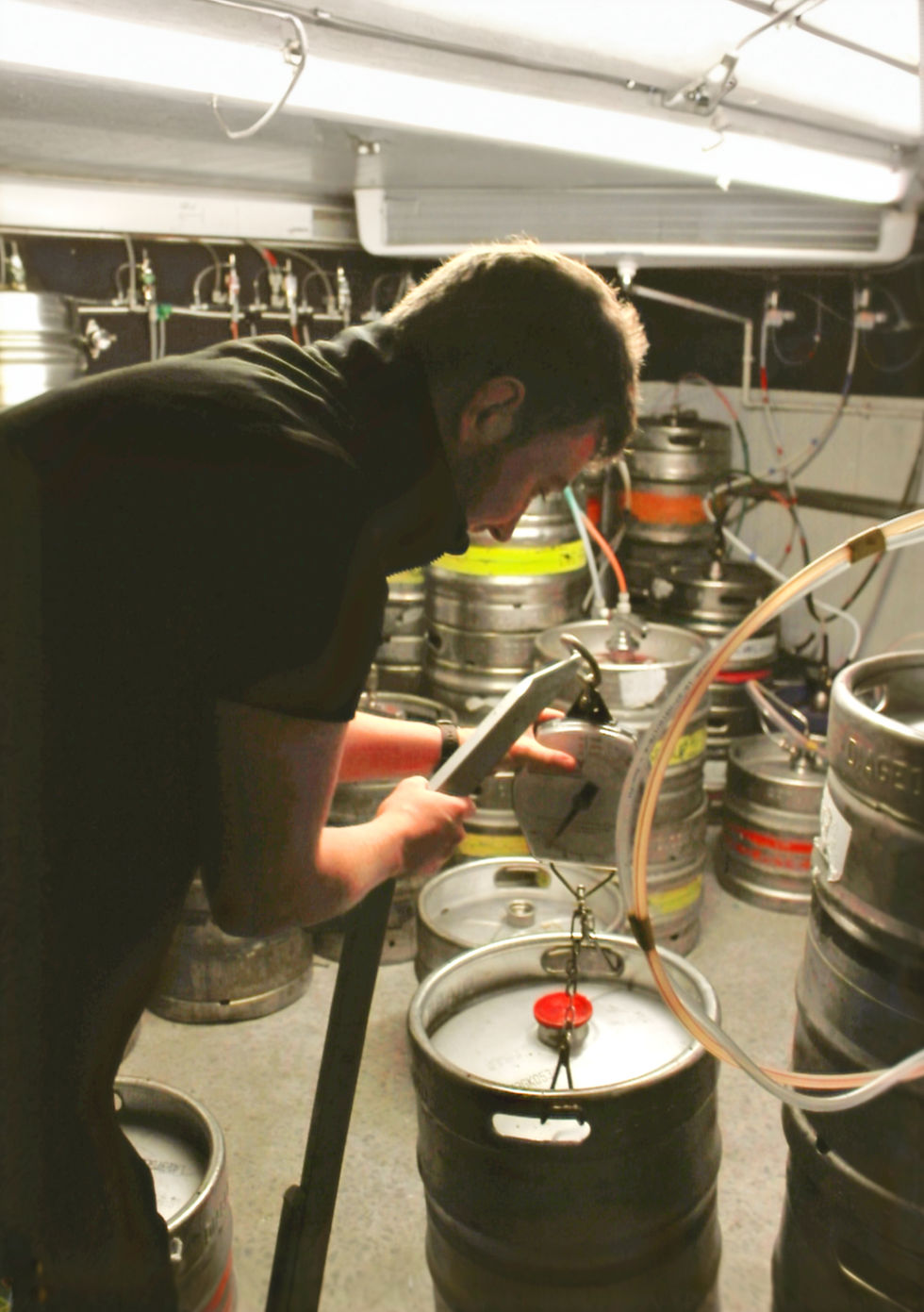 our stocktaker weighing a keg with ease with our bespoke keg weighing device