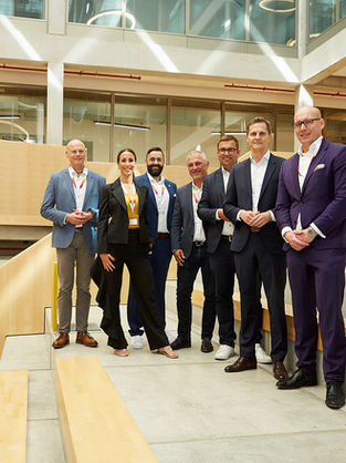 Group photo at WORKHUB with Brandenburg’s Minister for Justice and Digitalisation, Dr Benjamin Grimm, host Giulia Berger, and representatives from politics, academia, technology, law, finance and regional development.