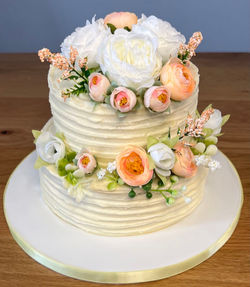 2 tier rum buttercream floral wedding cake