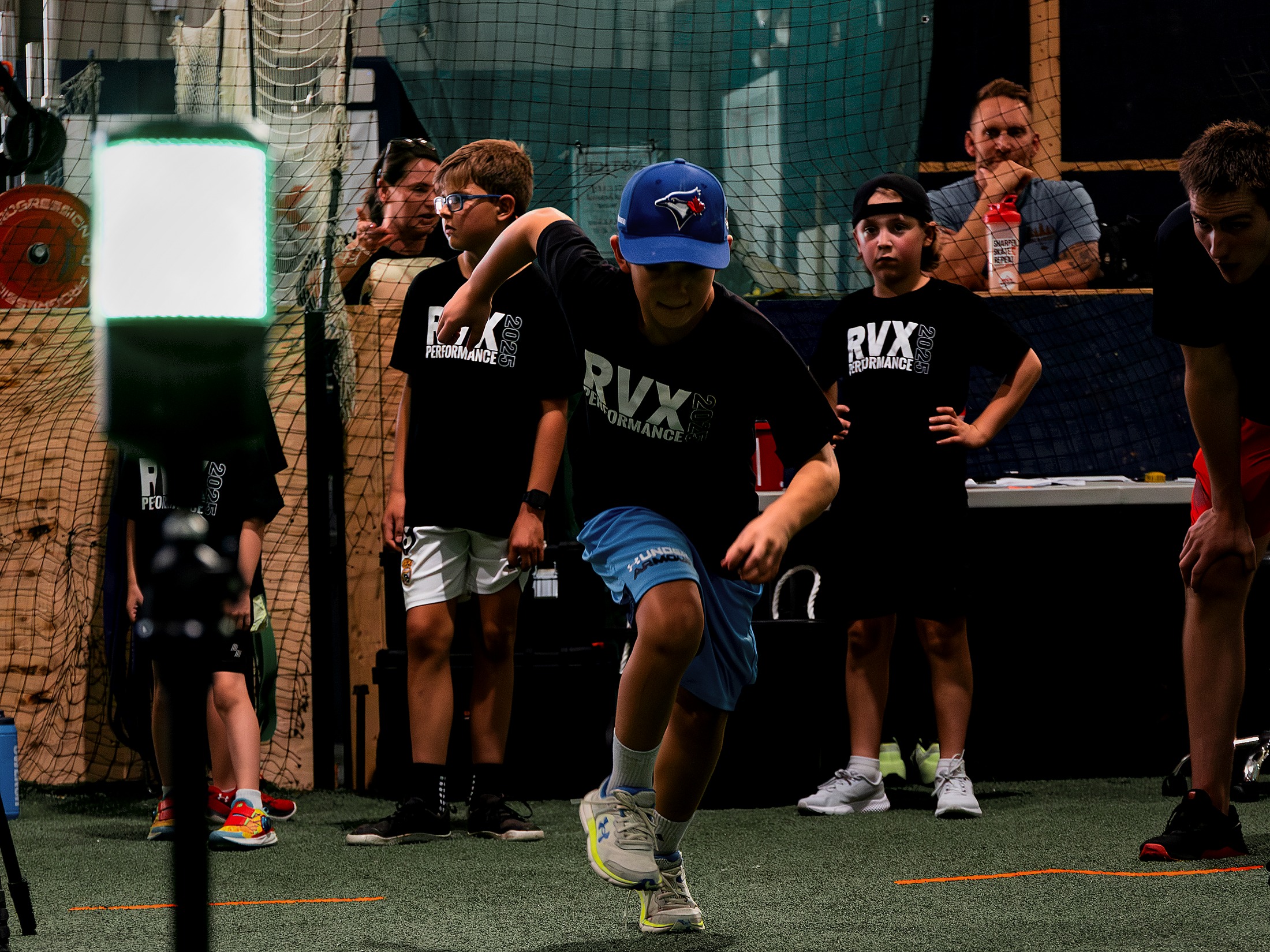 RVX coach guiding athletes through a performance training session