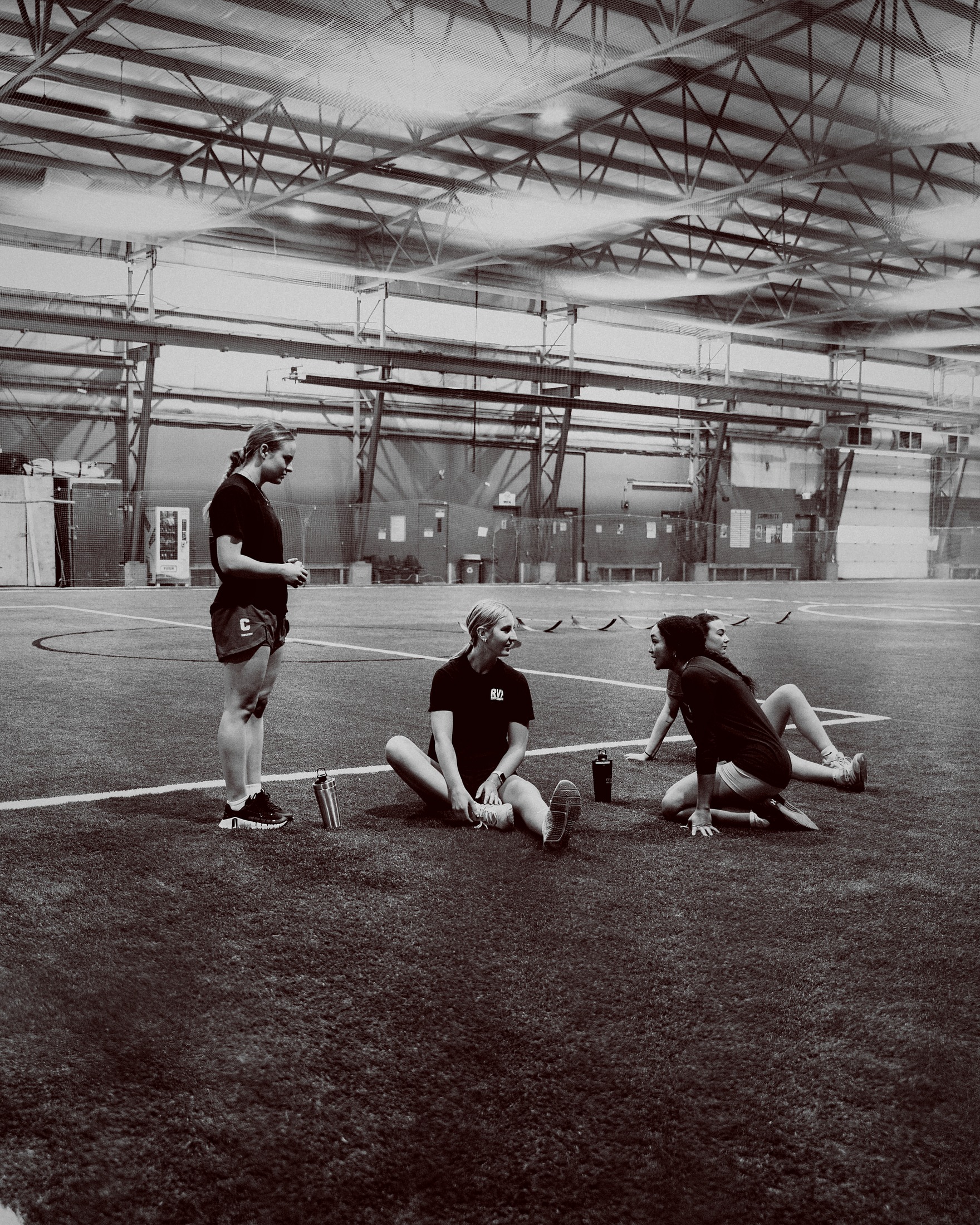 RVX athletes training together on indoor turf