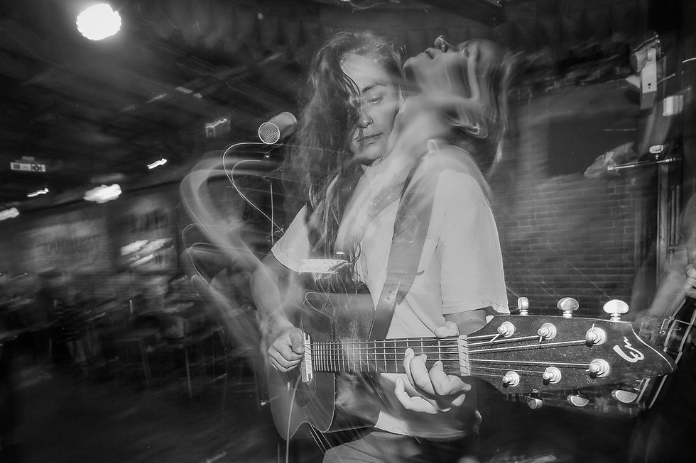 I love how show shutter speeds show the movement of musicians on stage, creating an illusion as if they are moving.